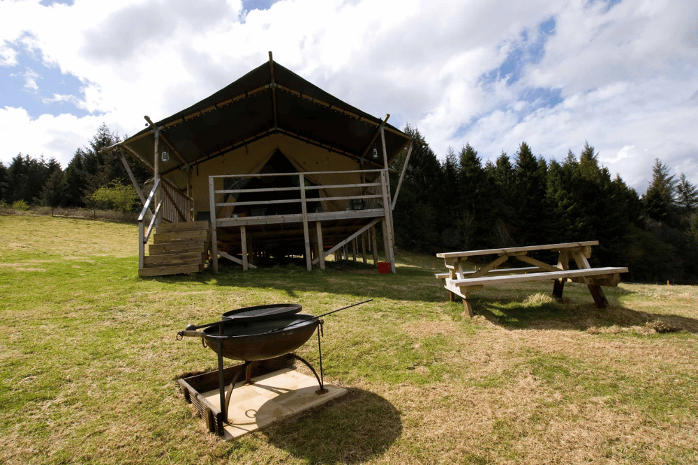 Fire pit and outside seating and safari tent